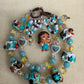 Teal Overalls Phone Charm